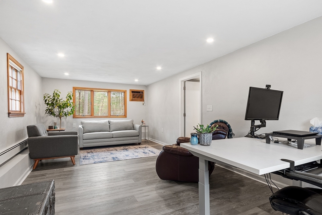 16 Michael Road Maynard, MA 01754 - Photo 24 of 39 a living room with furniture flat screen tv and window