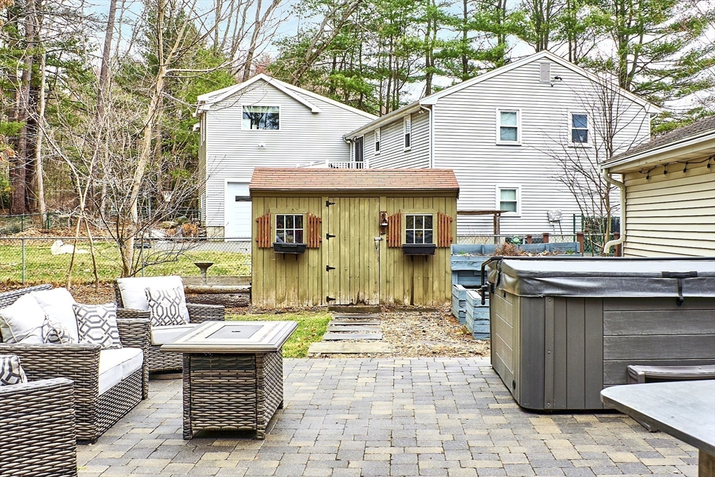 16 Michael Road Maynard, MA 01754 - Photo 31 of 39 a view of a white house with a chairs in patio