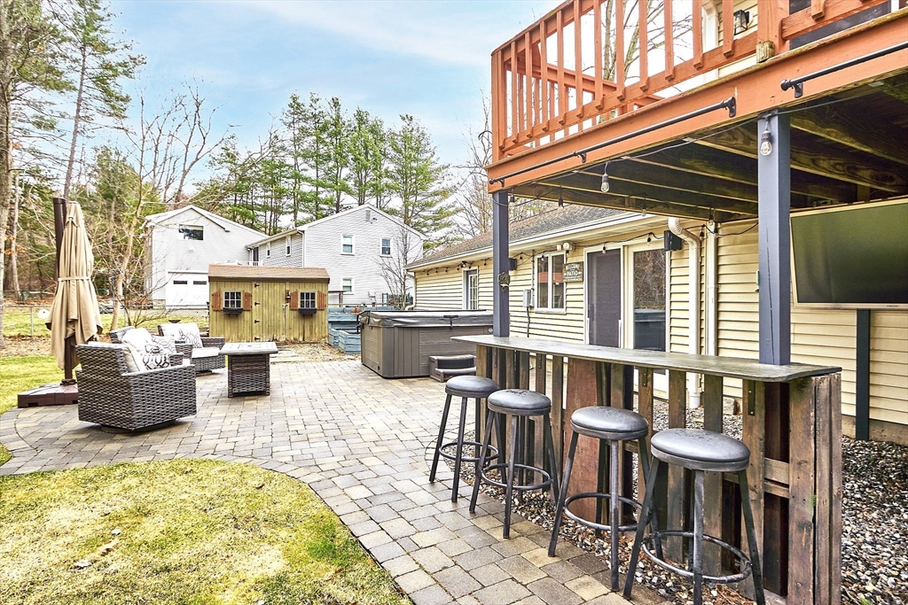 16 Michael Road Maynard, MA 01754 - Photo 32 of 39 a view of a patio with couches table and chairs and potted plants