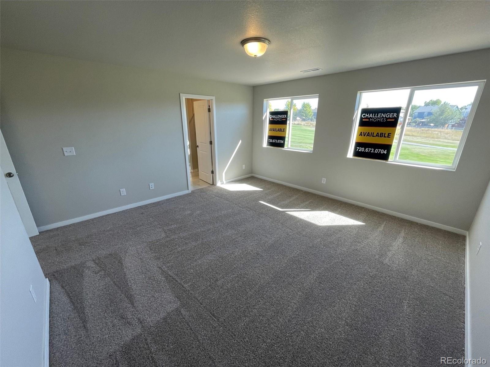 534 Ryan Avenue Fort Lupton, CO 80621 - Photo 11 of 25 a view of a livingroom with an empty space and a window