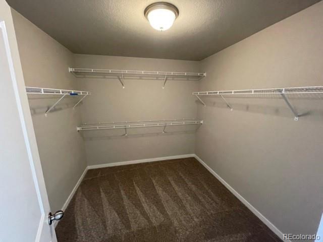 534 Ryan Avenue Fort Lupton, CO 80621 - Photo 13 of 25 a view of a room with racks on the wall