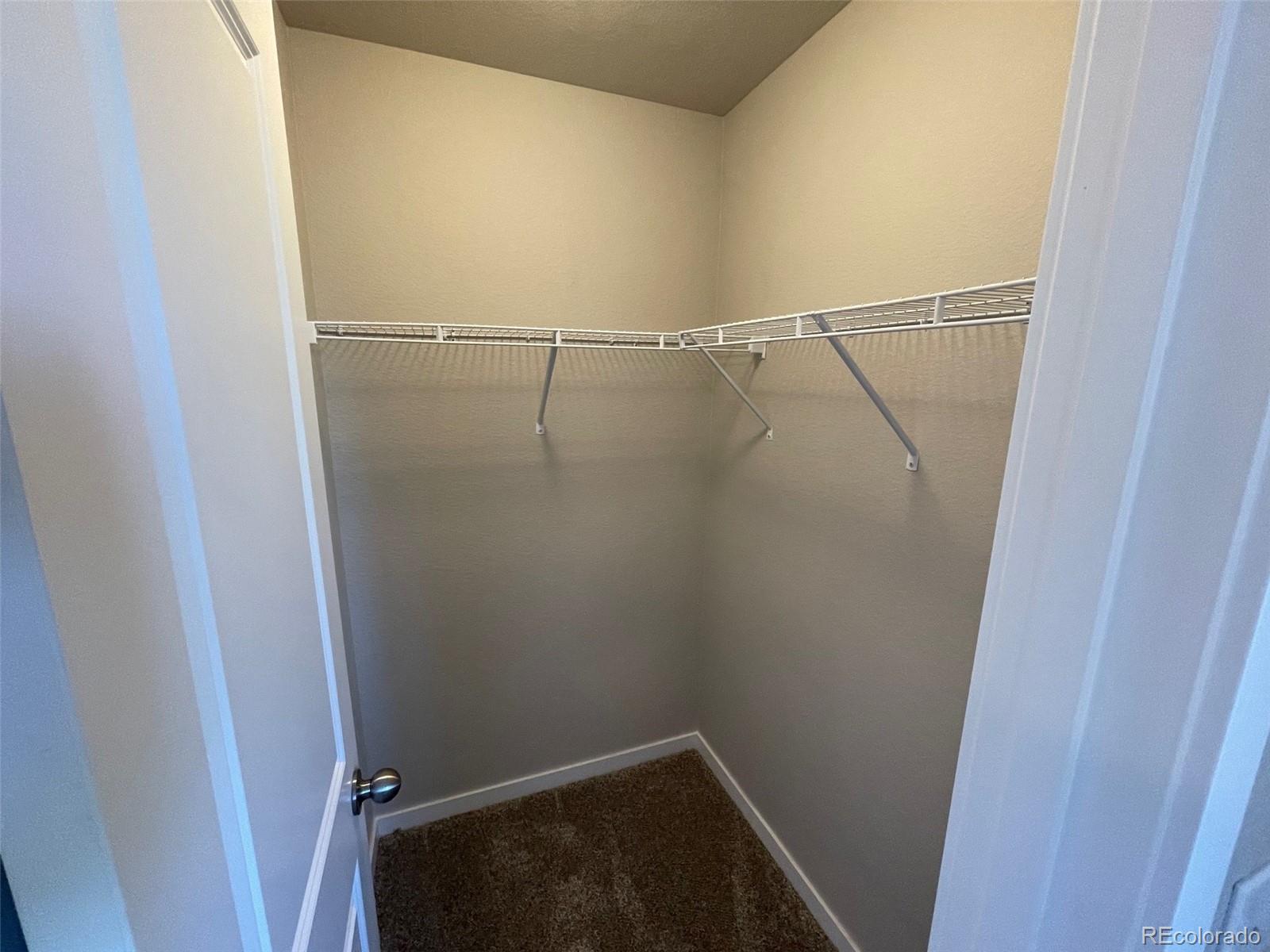 534 Ryan Avenue Fort Lupton, CO 80621 - Photo 22 of 25 a view of a room with racks on the wall