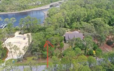 an aerial view of a houses with outdoor space and garden