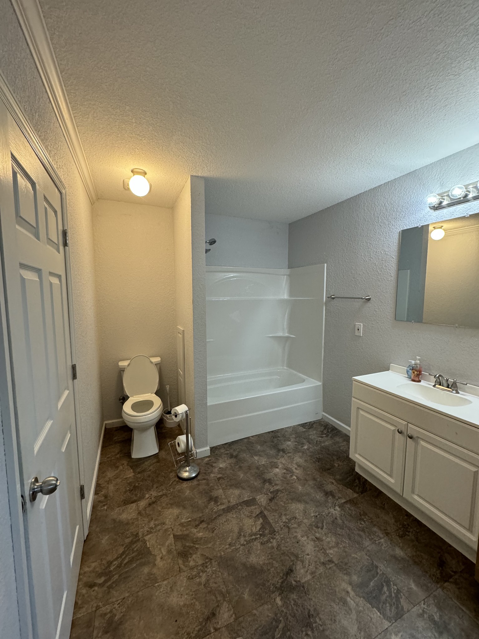 191 Williams Road Manchester, TN 37355 - Photo 12 of 17 a bathroom with a granite countertop sink a toilet and a mirror