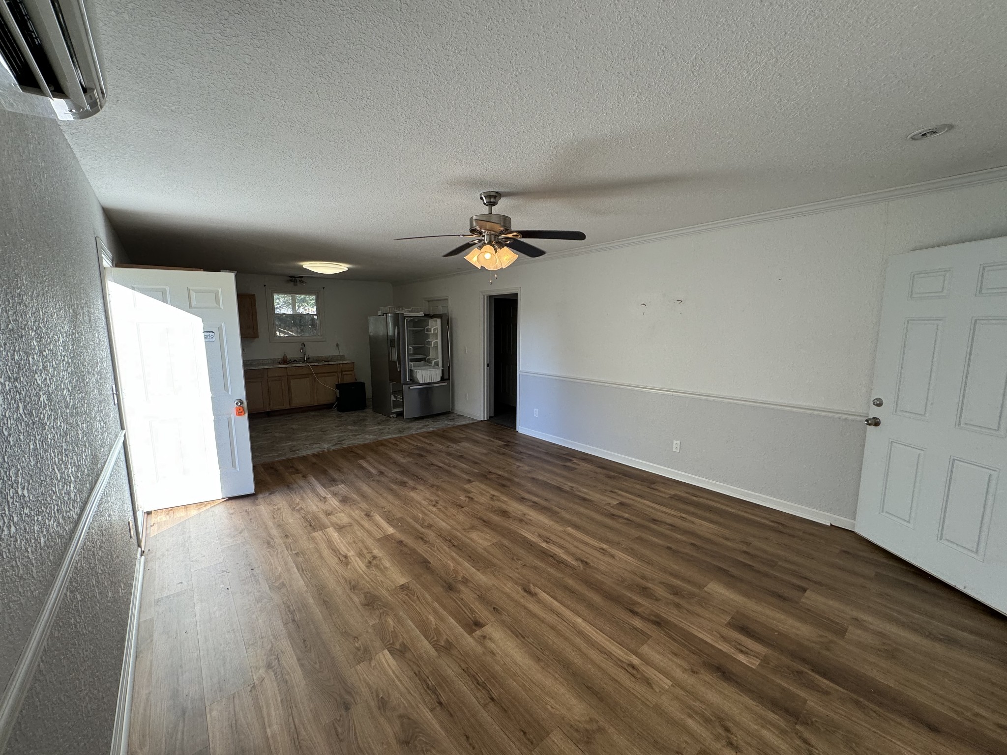191 Williams Road Manchester, TN 37355 - Photo 8 of 17 wooden floor in an empty room with a window