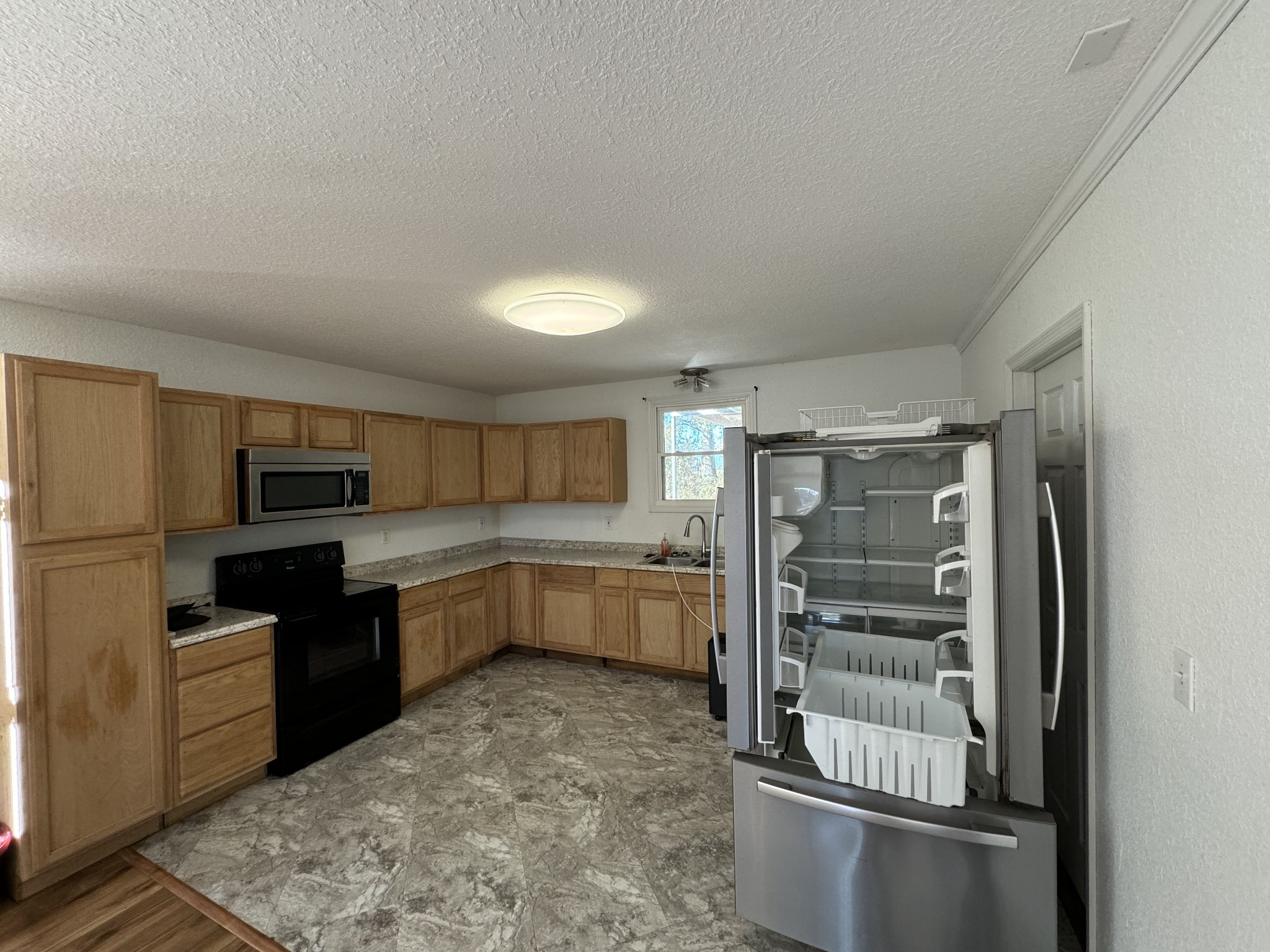 191 Williams Road Manchester, TN 37355 - Photo 9 of 17 a kitchen with a refrigerator and a sink