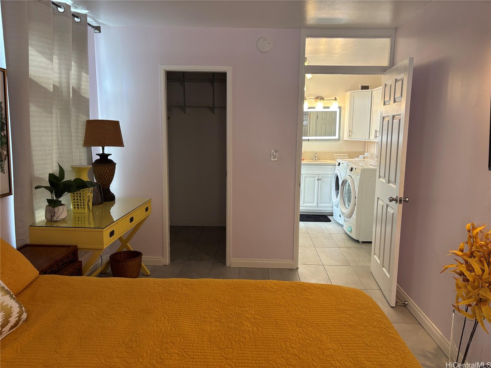 225 Kaʻiulani Avenue, Unit 402 Honolulu, HI 96815 - Photo 12 of 16 a bedroom with a bed and a view of living room