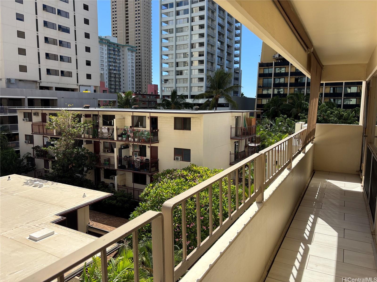 225 Kaʻiulani Avenue, Unit 402 Honolulu, HI 96815 - Photo 5 of 16 a view of balcony with chairs