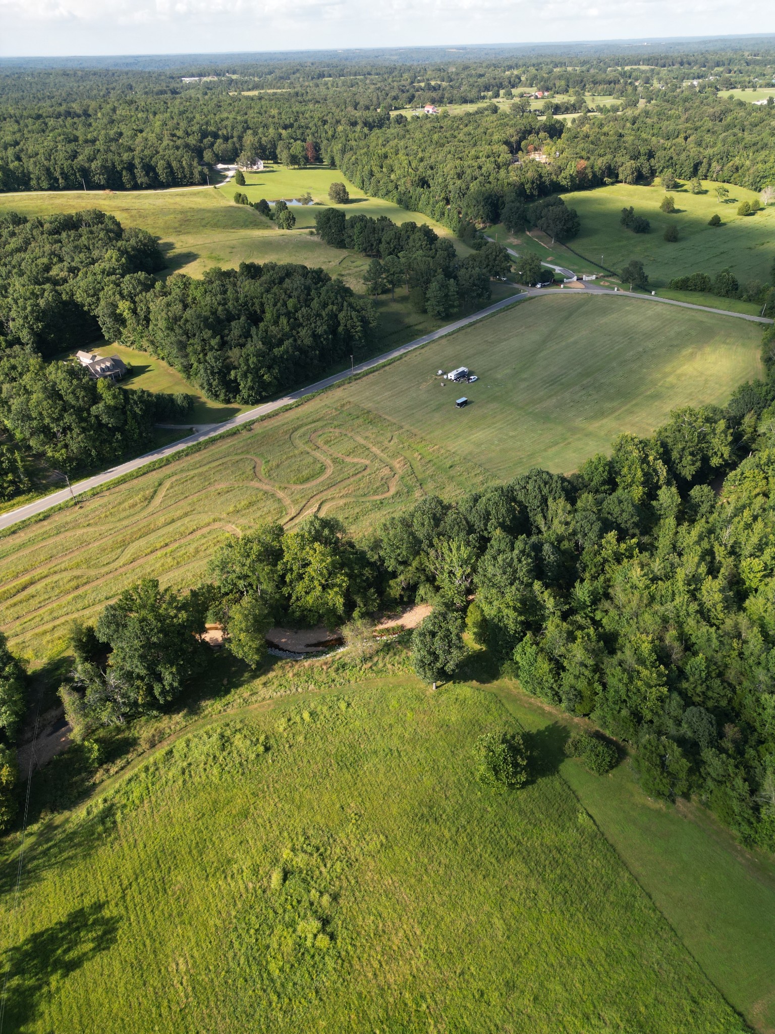 0 Curtis Chapel Road McEwen, TN 37101 - Photo 5 of 5 an aerial view of a houses with outdoor space and river