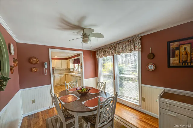 a dining room with furniture and window