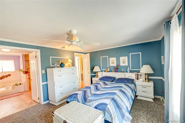 a bedroom with furniture and a chandelier