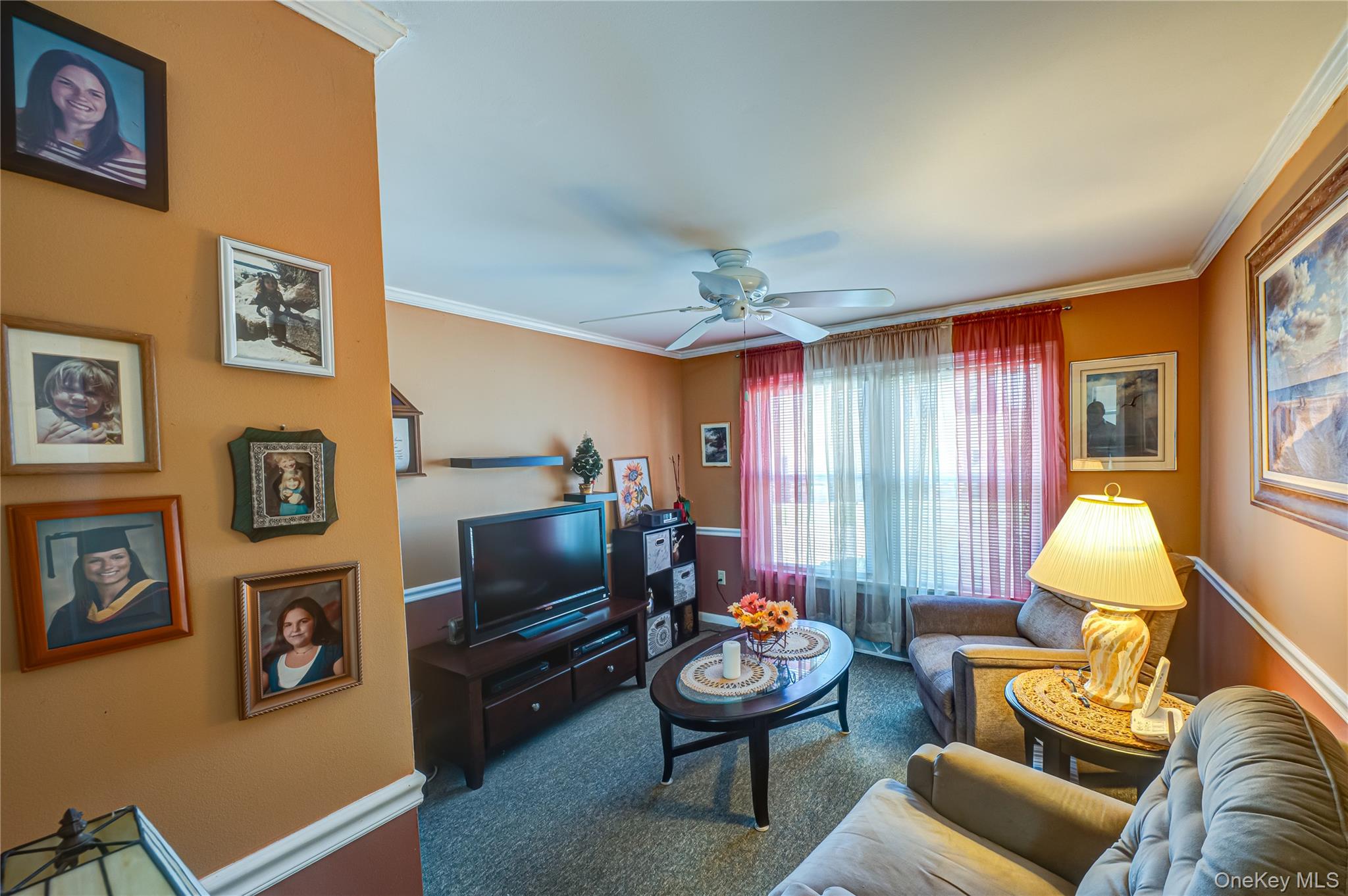 1407 Middle Road, Unit 6 Calverton, NY 11933 - Photo 19 of 25 a living room with furniture and a flat screen tv