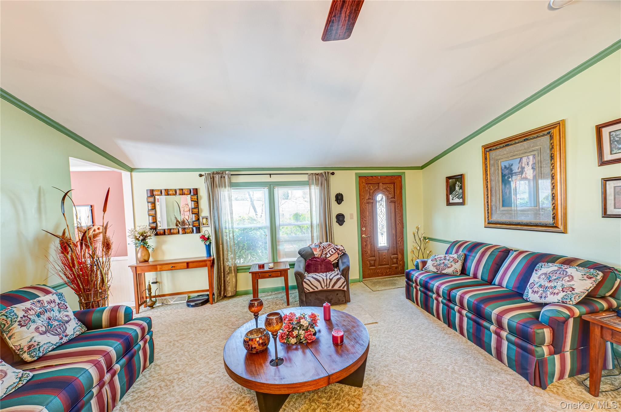 1407 Middle Road, Unit 6 Calverton, NY 11933 - Photo 5 of 25 a living room with furniture and a large window