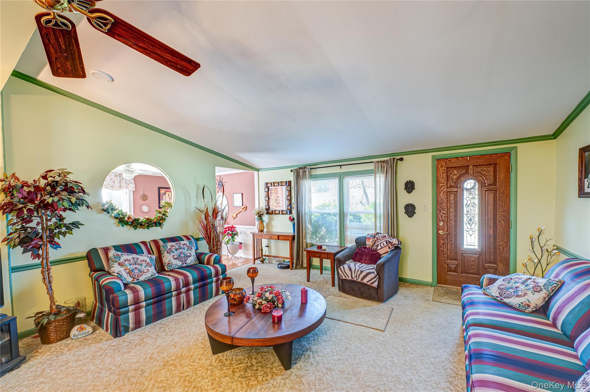 1407 Middle Road, Unit 6 Calverton, NY 11933 - Photo 7 of 25 a living room with furniture and flowers