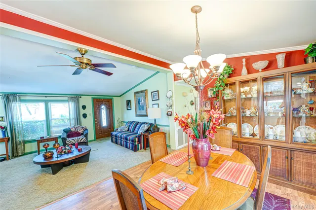 a living room with furniture chandelier and a chandelier