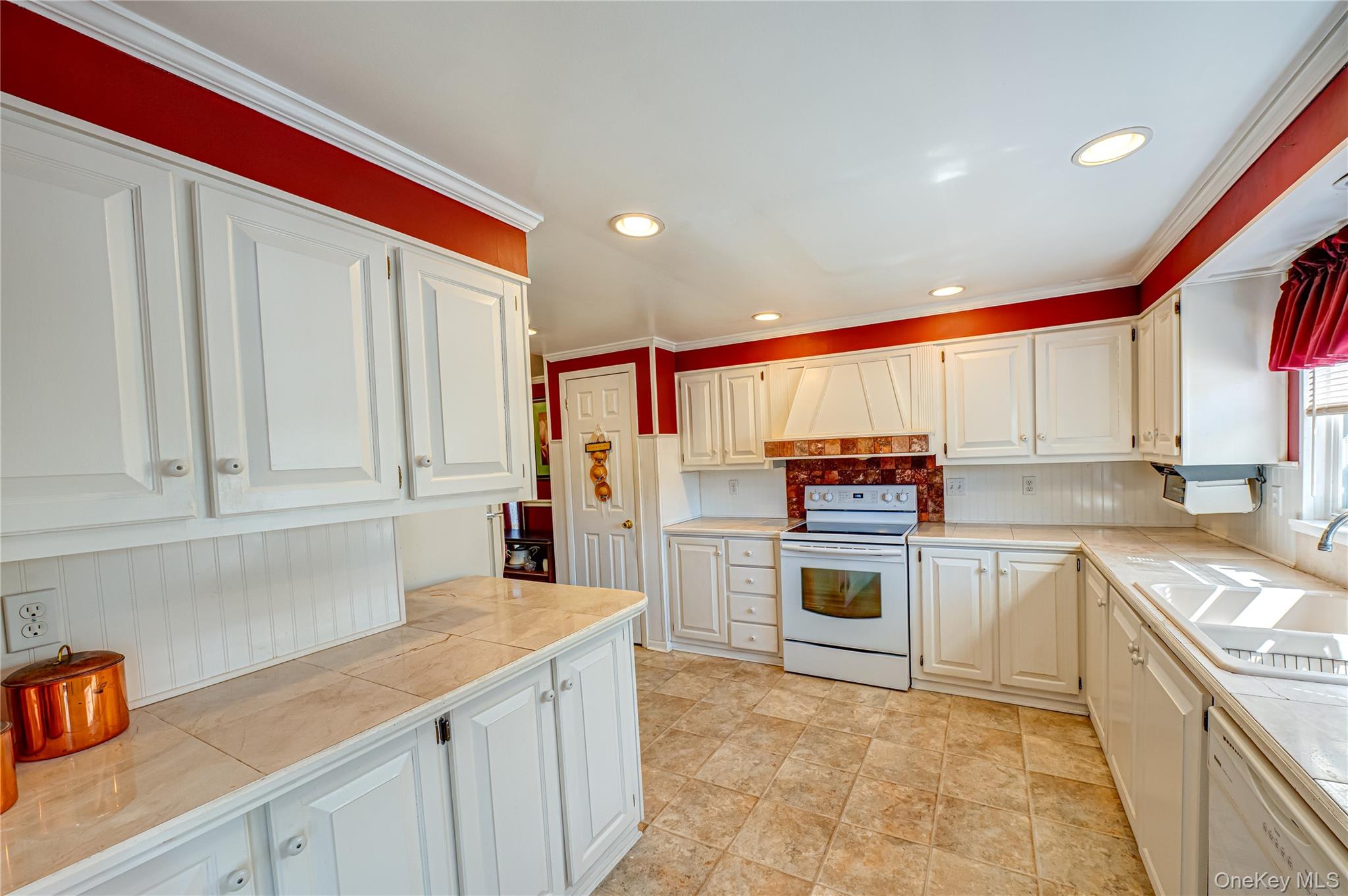 1407 Middle Road, Unit 6 Calverton, NY 11933 - Photo 10 of 25 a kitchen with stainless steel appliances granite countertop a refrigerator and a stove top oven