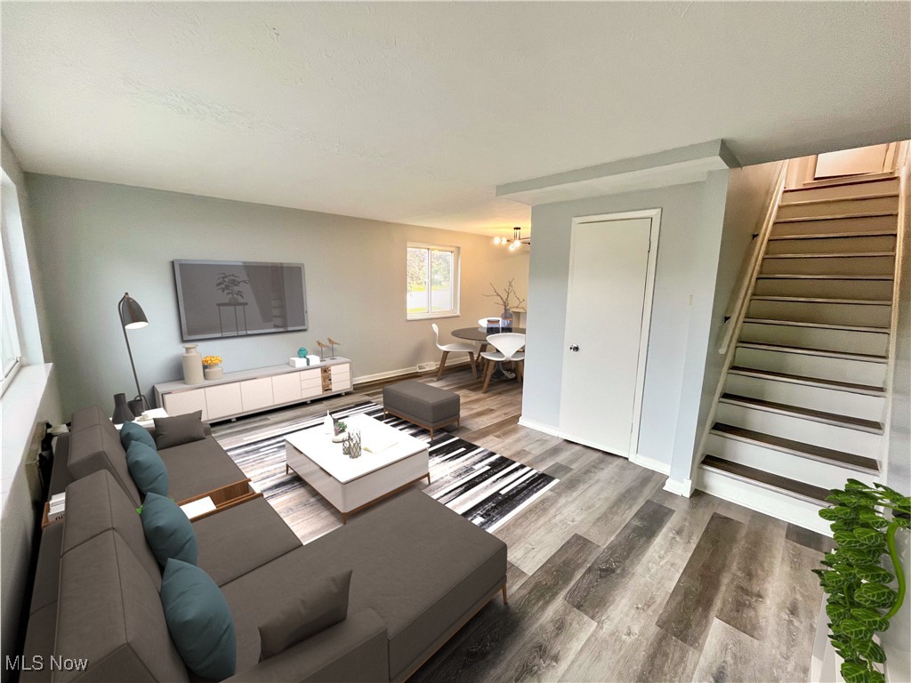 2868 Noble Road, Unit 16 Cleveland, OH 44121 - Photo 2 of 6 Living area featuring stairway and wood finished floors