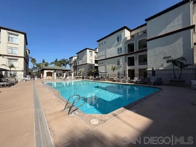 a view of a swimming pool with a patio