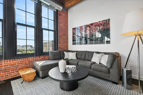 a living room with furniture and a window