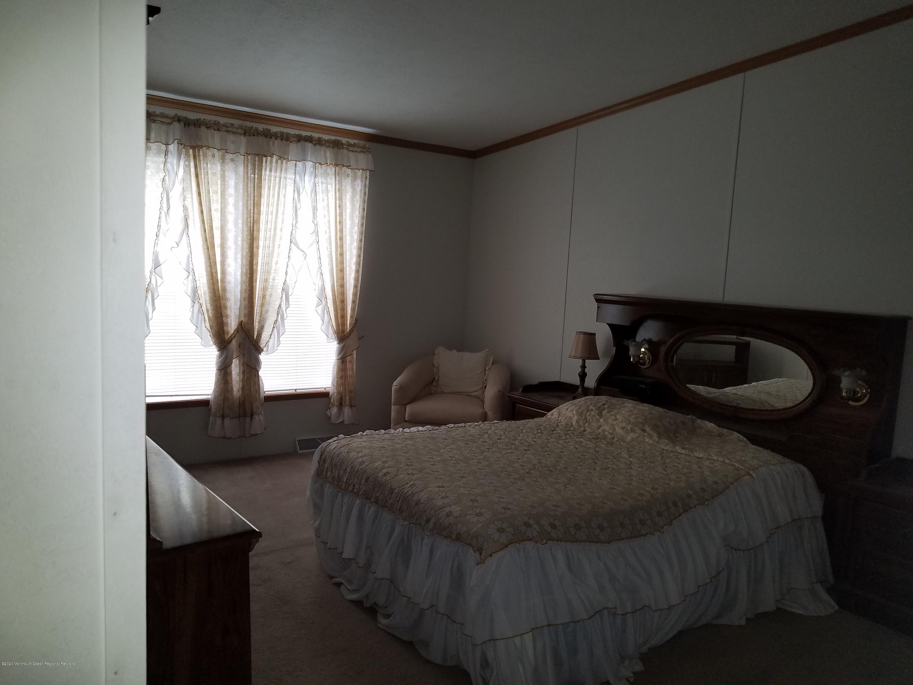 74 Pine Ridge Boulevard Whiting, NJ 08759 - Photo 16 of 28 a bedroom with two beds and a window