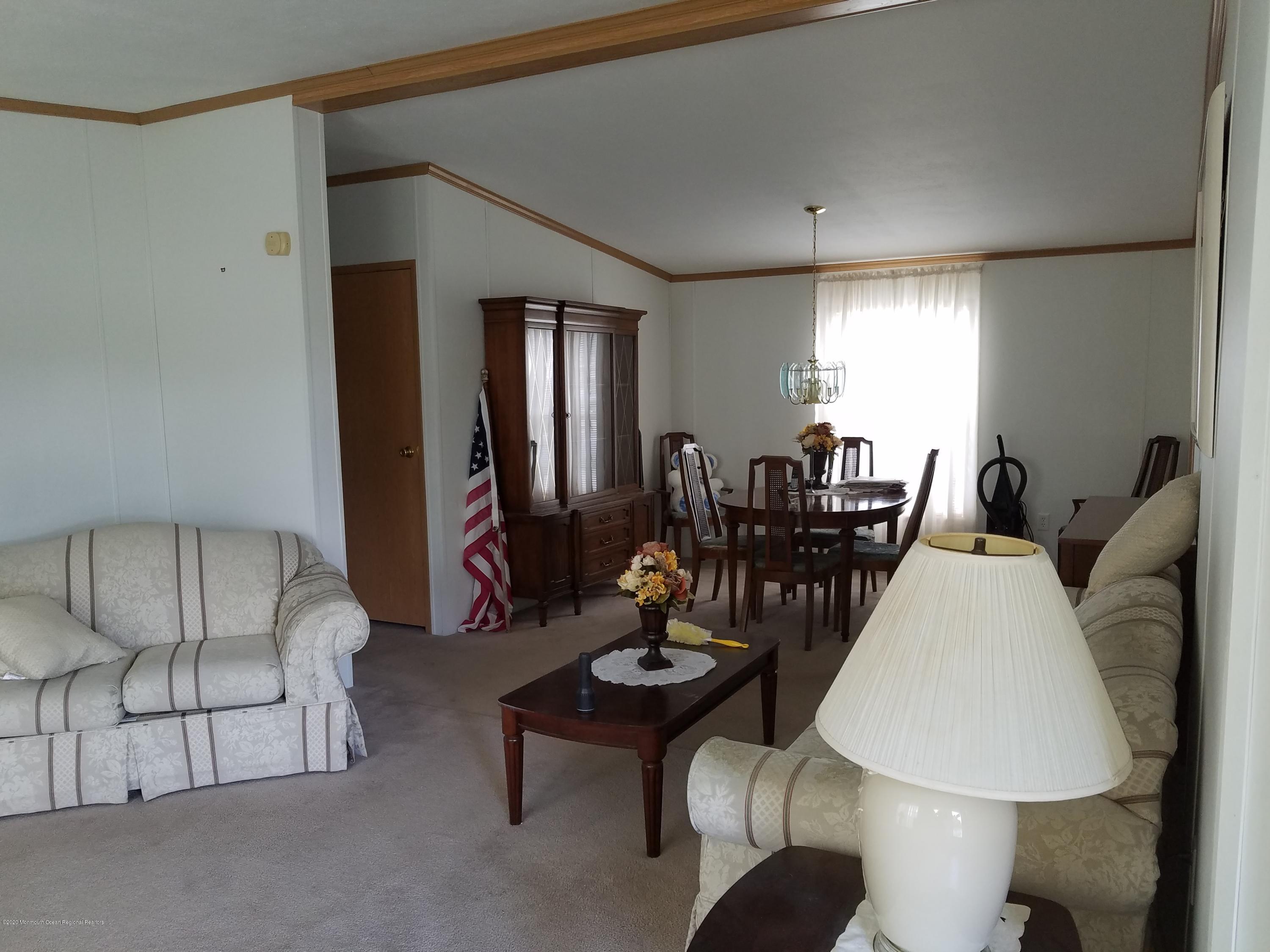 74 Pine Ridge Boulevard Whiting, NJ 08759 - Photo 3 of 28 a living room with furniture and wooden floor