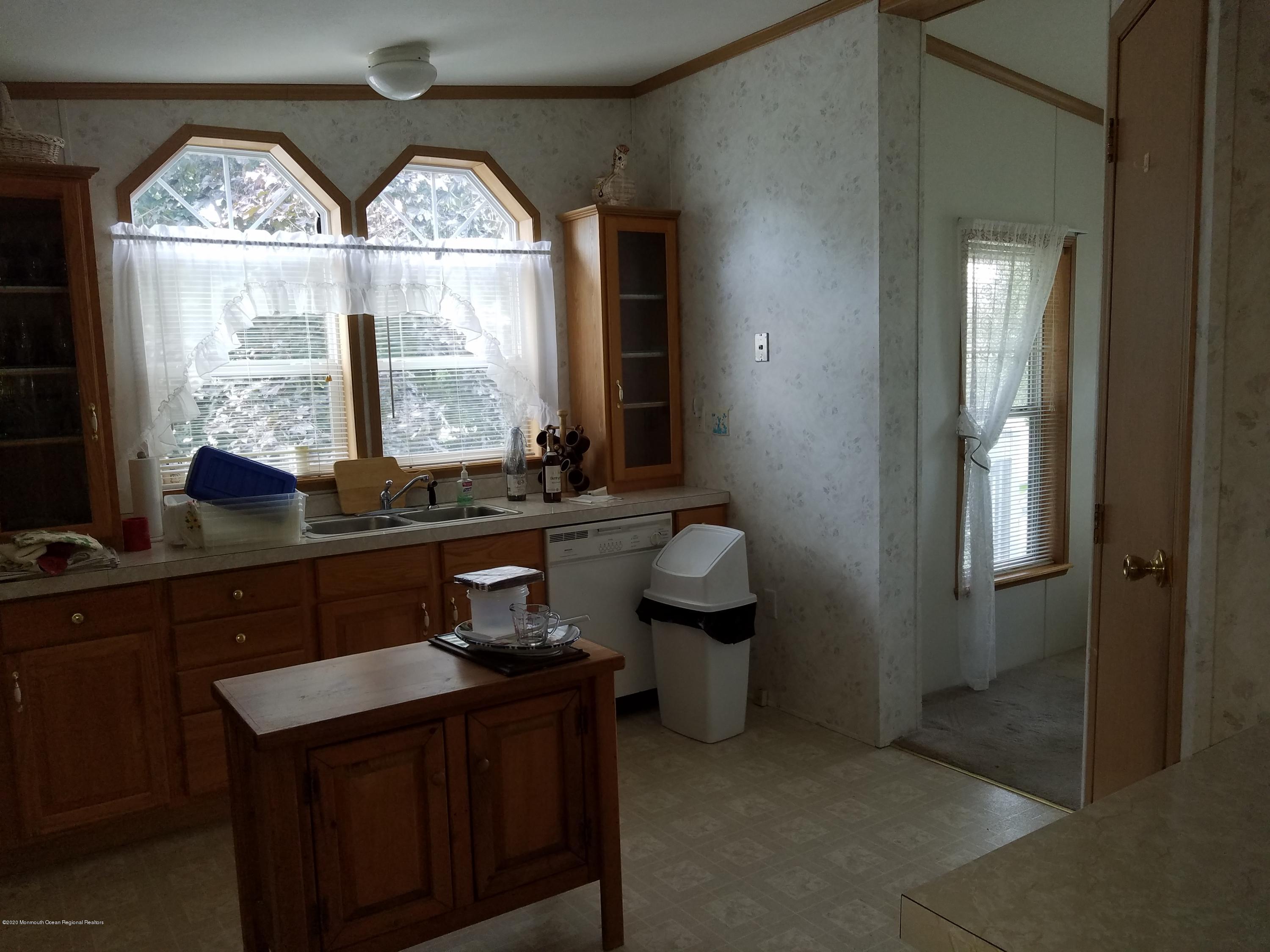 74 Pine Ridge Boulevard Whiting, NJ 08759 - Photo 10 of 28 a bathroom with a toilet a sink and a window