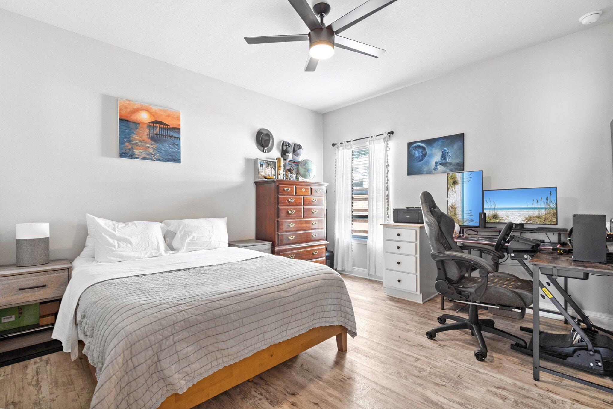 199 Southern Pnes Road Santa Rosa Beach, FL 32459 - Photo 26 of 44 a bedroom with a bed a desk and chair