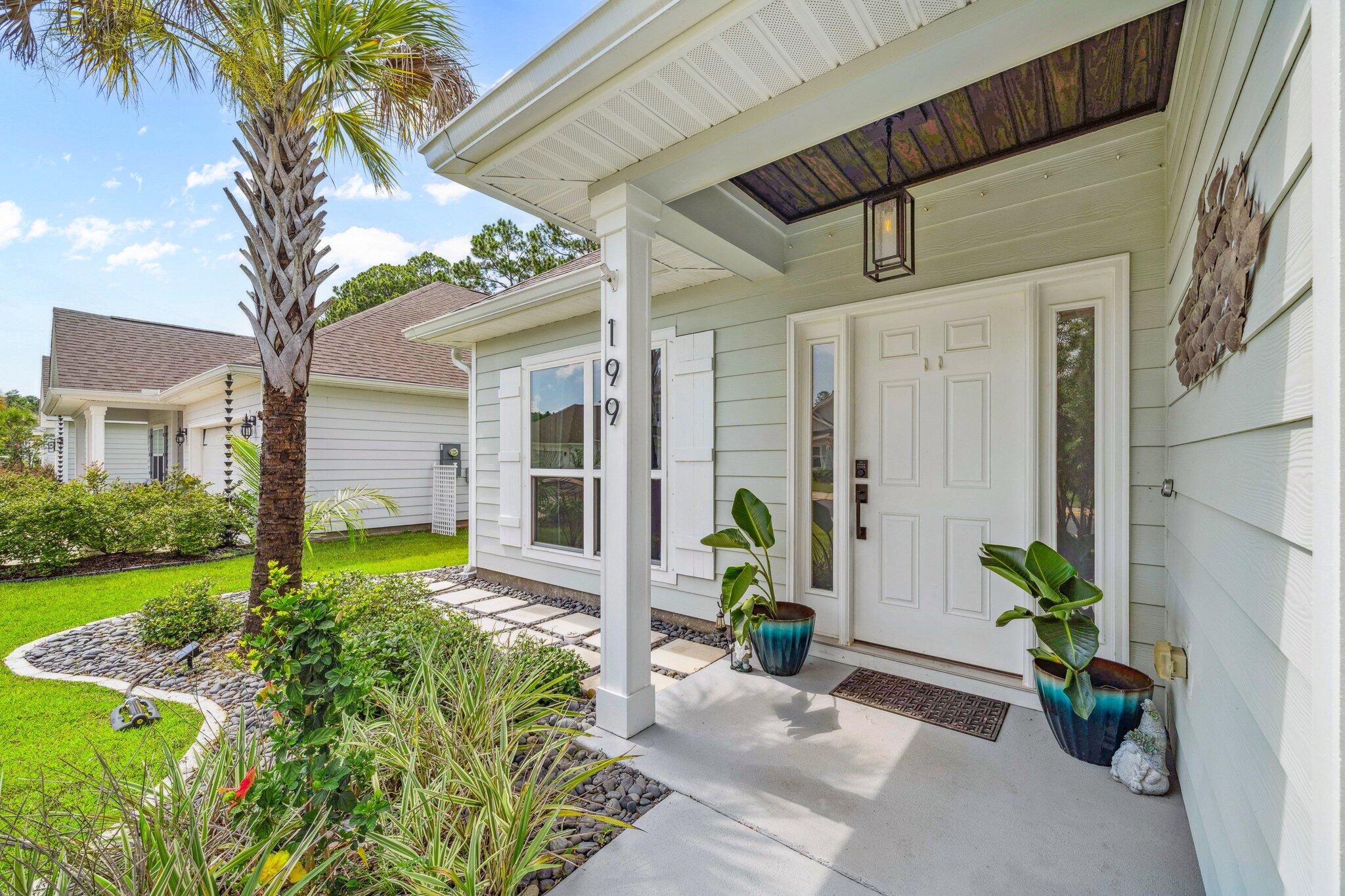 199 Southern Pnes Road Santa Rosa Beach, FL 32459 - Photo 4 of 44 a front view of a house with garden