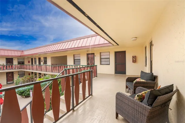 a front view of house with outdoor space and garden