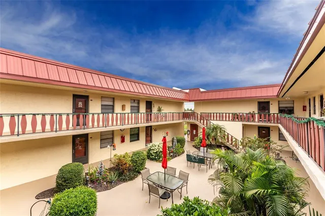 a view of a living room and kitchen