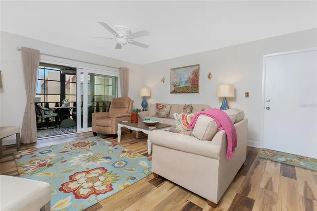 a living room with fireplace furniture and a flat screen tv