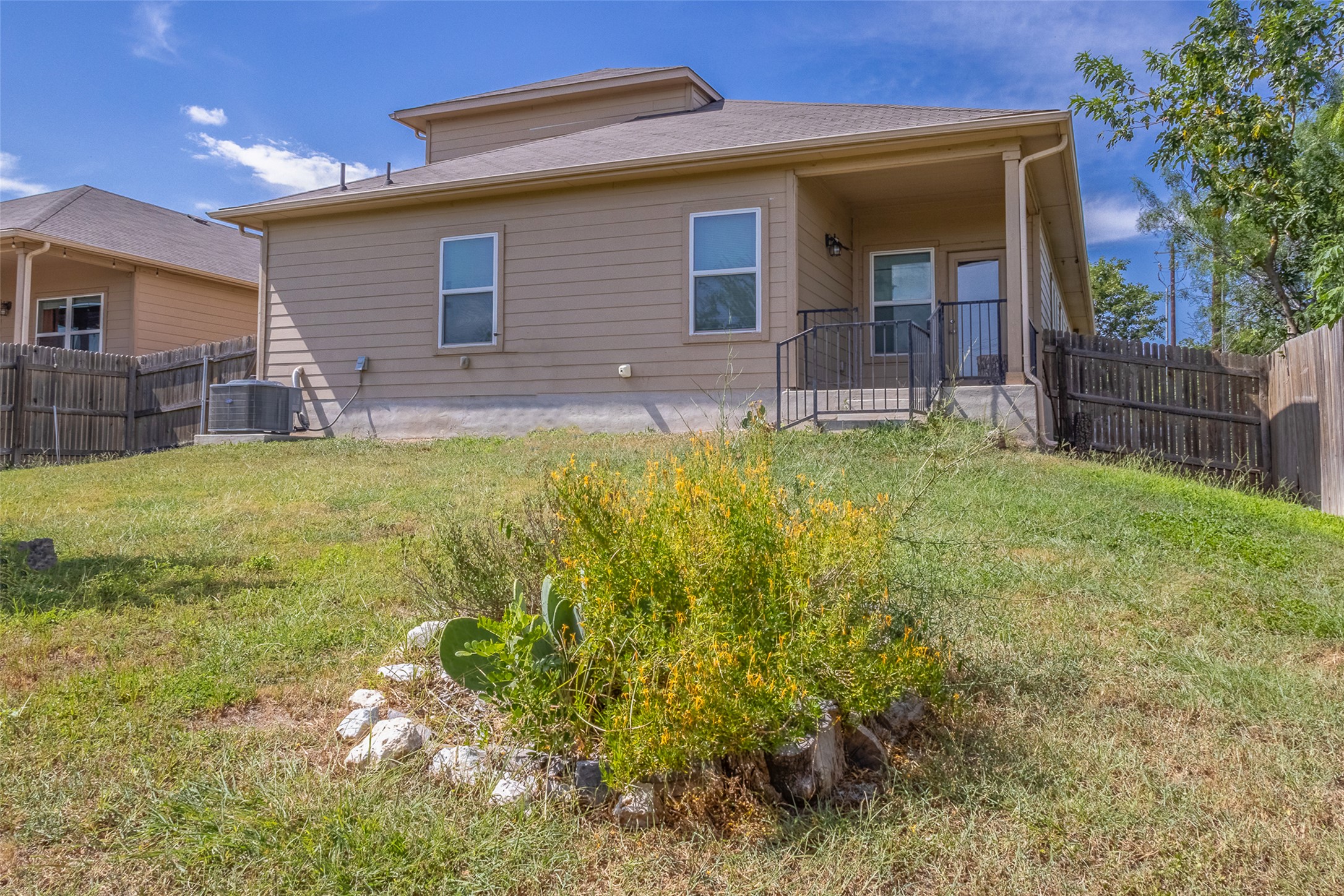 7225 Ranchito Drive Austin, TX 78744 - Photo 28 of 39 An inviting rear patio provides seamless outdoor access from this charming property.