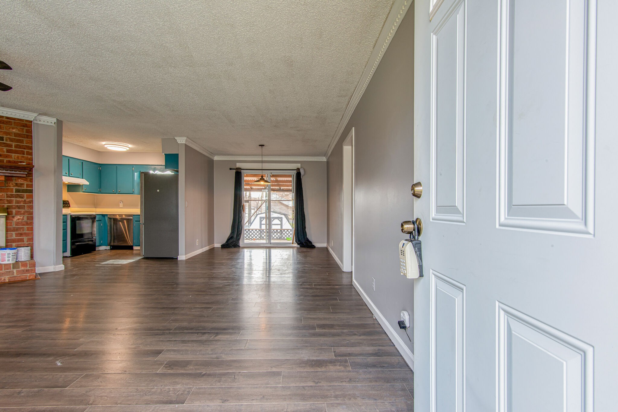 3309 Country Way Road Antioch, TN 37013 - Photo 4 of 26 a view of an empty room with wooden floor and a window