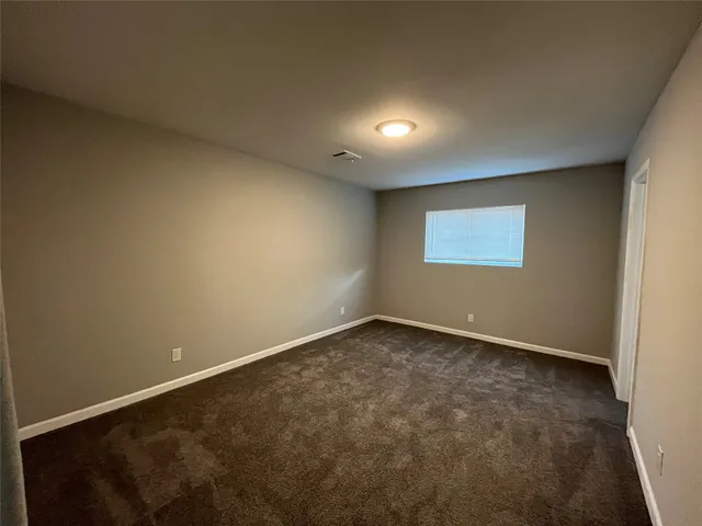 an empty room with a empty space and window