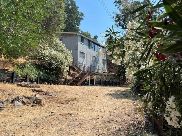 a view of house with snow on the road