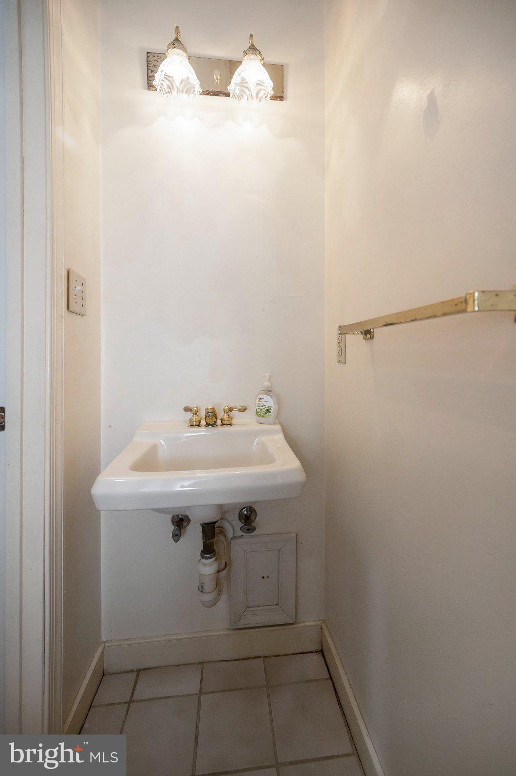 130 Springwood Drive, Unit RENTAL Fredericksburg, VA 22401 - Photo 13 of 39 Charming half-bath with elegant lighting.