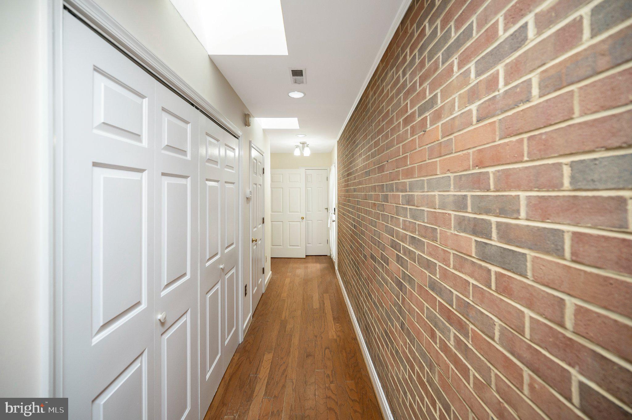130 Springwood Drive, Unit RENTAL Fredericksburg, VA 22401 - Photo 15 of 39 Charming hallway with brick accents.