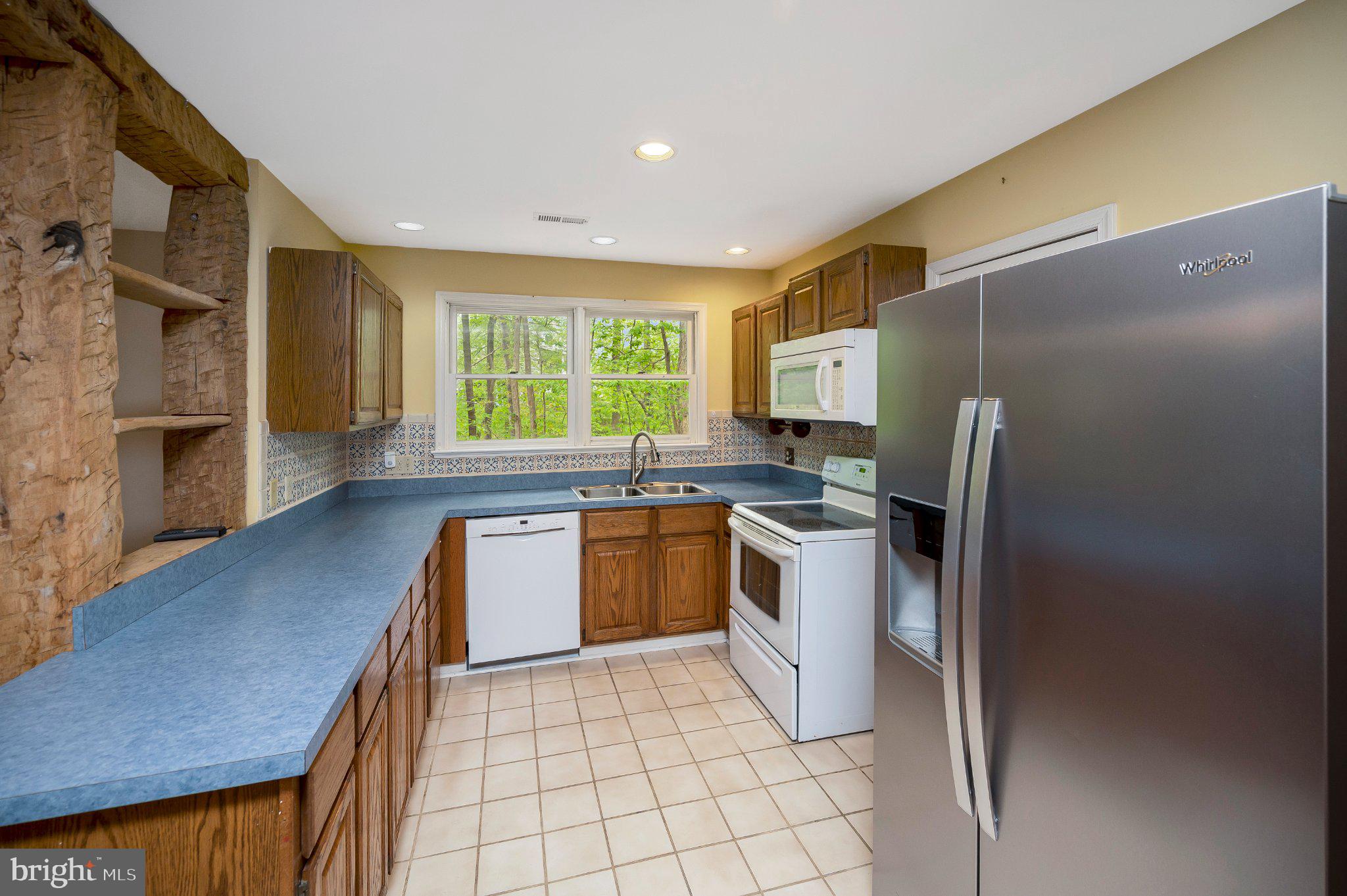 130 Springwood Drive, Unit RENTAL Fredericksburg, VA 22401 - Photo 17 of 39 Bright kitchen with natural light.