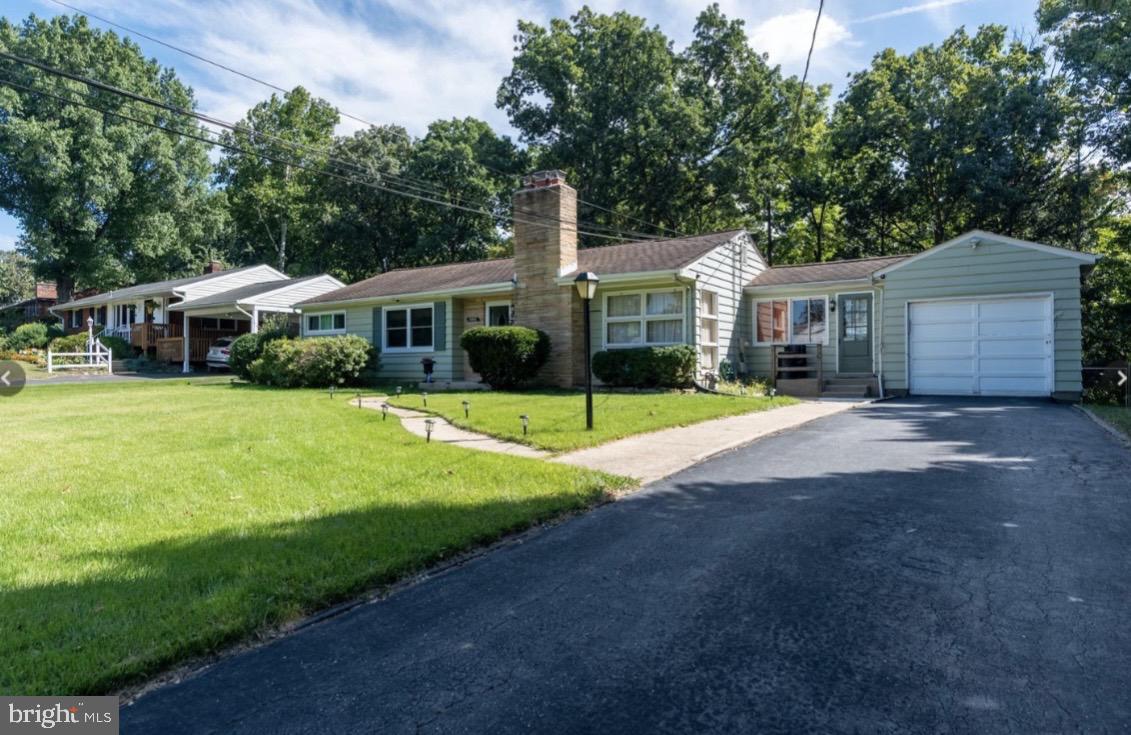4005 Foreston Road Beltsville, MD 20705 - Photo 1 of 1 a view of a house with a patio and yard