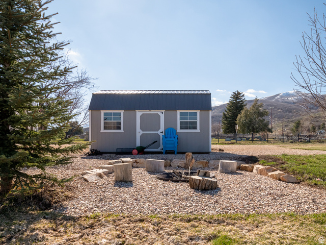 641 West 500 South Midway, UT 84049 - Photo 51 of 52 Detached storage shed featuring a corrugated metal roof and white-framed windows