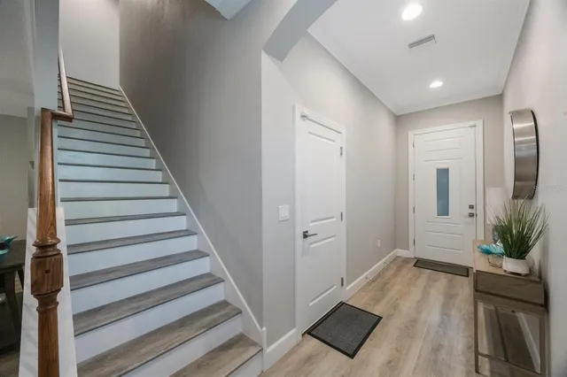 a bedroom with a large bed and a couch