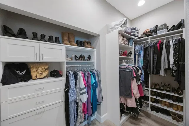 a bathroom with a double vanity sink mirror and shower