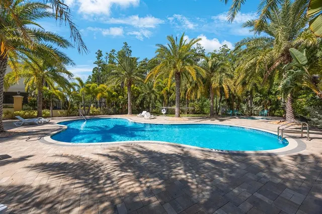 a kitchen with stainless steel appliances a stove a sink and a refrigerator