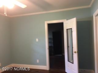 1217 Stockton Road Kinston, NC 28504 - Photo 10 of 20 Master bedroom, wood floors, ceiling fan, attached full bath, walk in closet