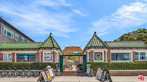 a view of building along with street and seating