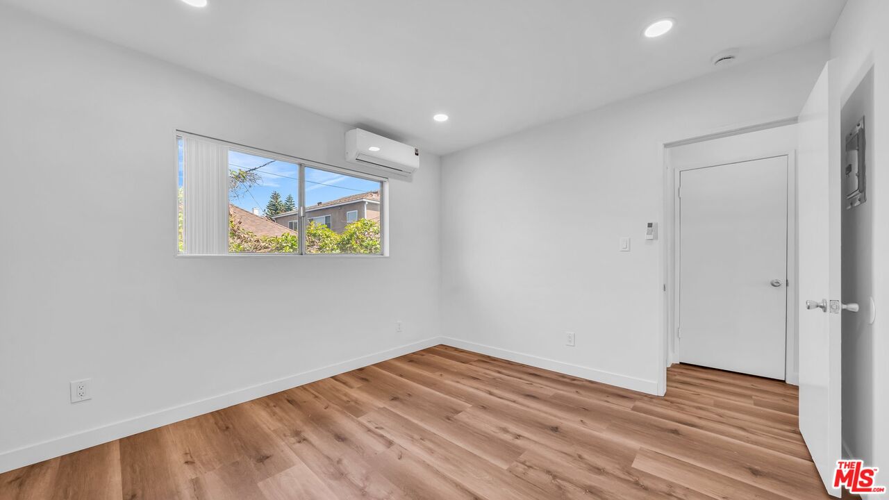 510 Pacific Avenue, Unit 6 Venice, CA 90291 - Photo 8 of 14 a view of room with wooden floor and window
