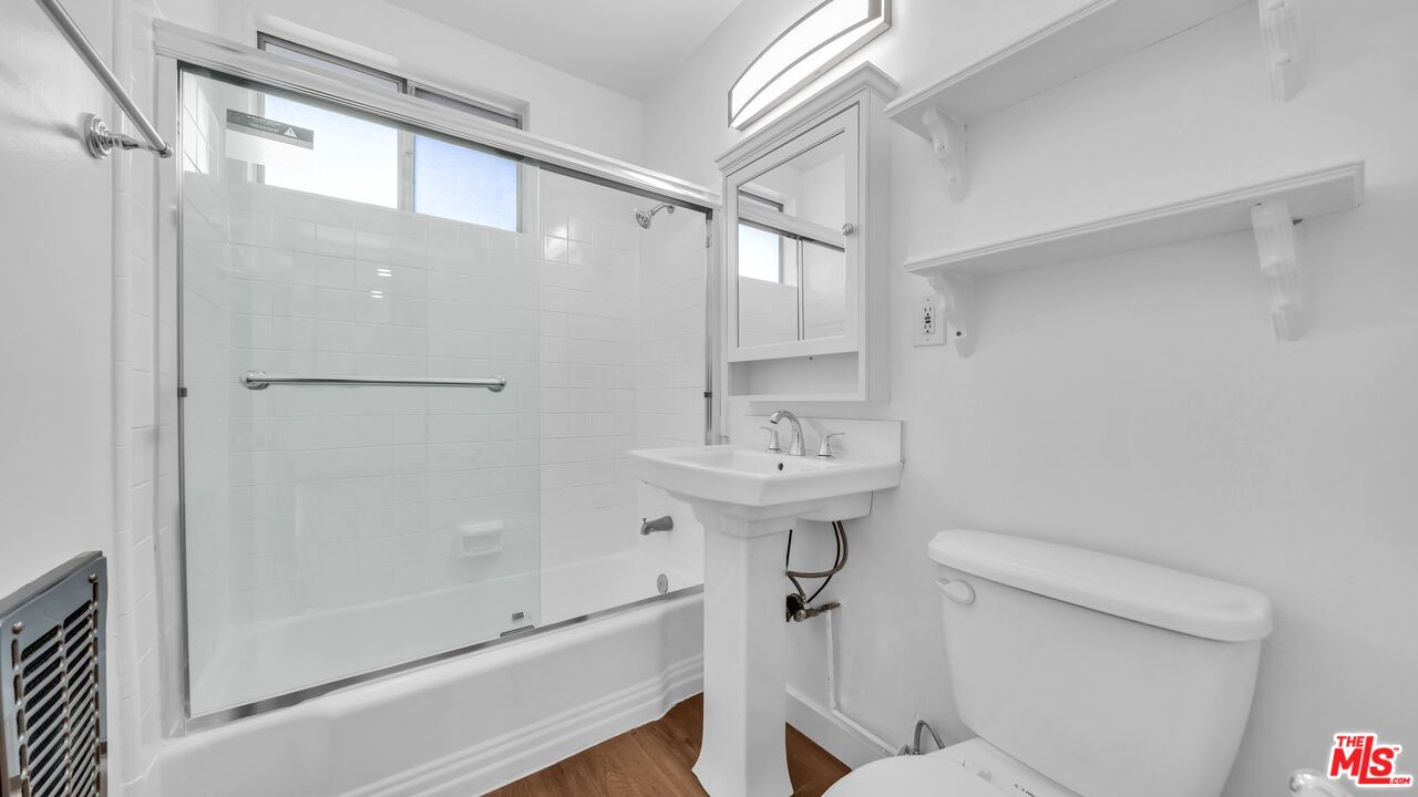 510 Pacific Avenue, Unit 6 Venice, CA 90291 - Photo 9 of 14 a bathroom with a sink toilet and shower