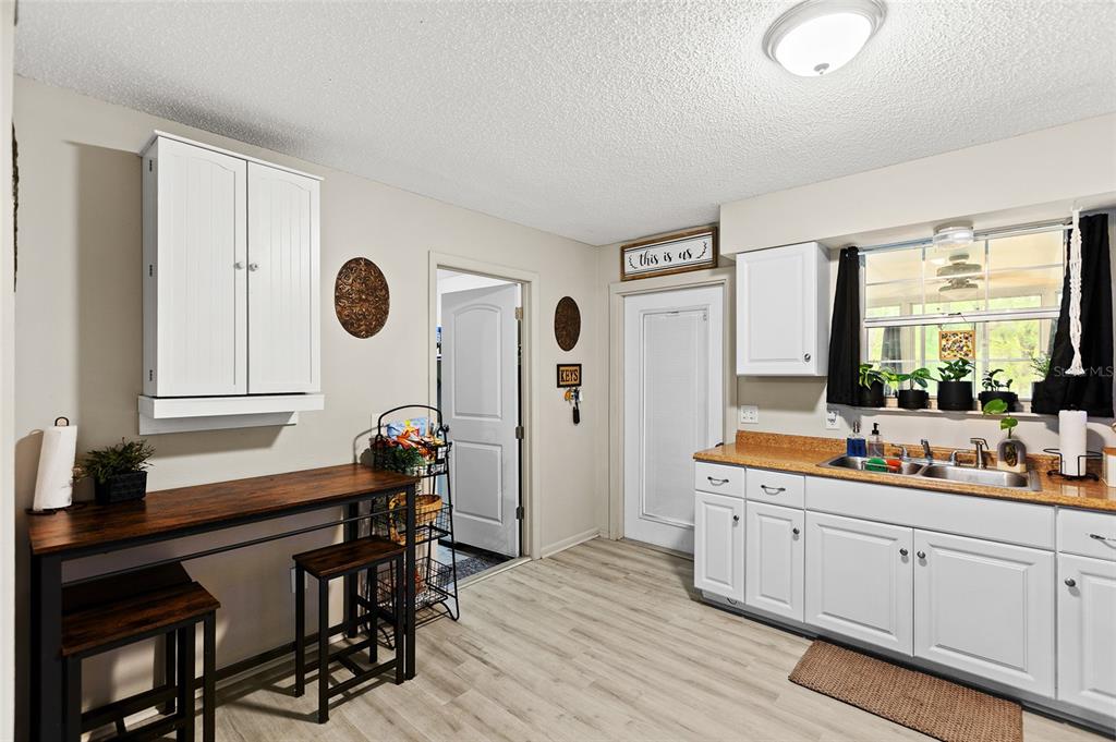 5420 East Gwendolyn Path Inverness, FL 34452 - Photo 12 of 42 a room with a table chairs and a large window