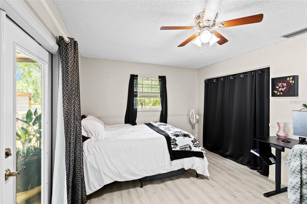 5420 East Gwendolyn Path Inverness, FL 34452 - Photo 15 of 42 a bedroom with a bed and a window