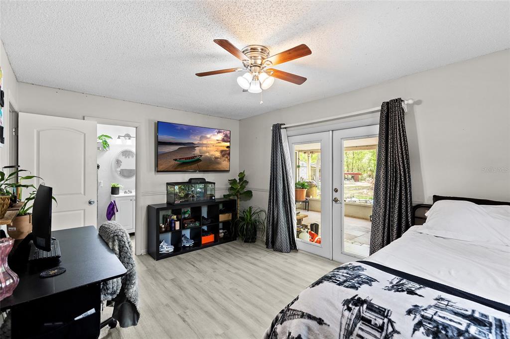 5420 East Gwendolyn Path Inverness, FL 34452 - Photo 18 of 42 a bedroom with a bed and a flat screen tv